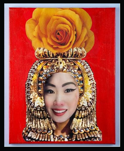A mixed-media portrait: a woman's face collaged onto a painted jewelled gold headdress on a red ground, topped with a large yellow rose.