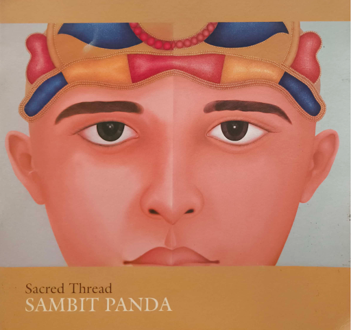 A split portrait illustration, a young man's face rendered twice side by side wearing a jewelled headdress, on a mustard-yellow ground with the words ‘Sacred Thread, Sambit Panda’ printed below.